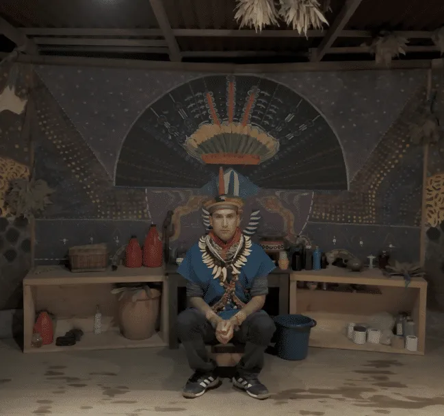 taita in medicine house in front of altar