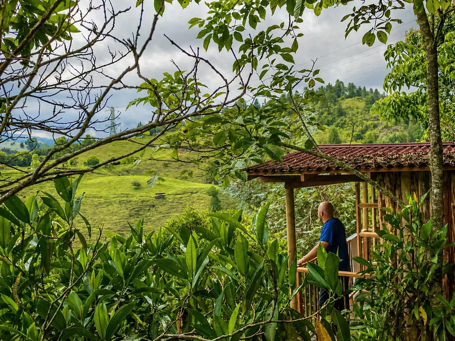 A cabin on a green hillside in the retreat area