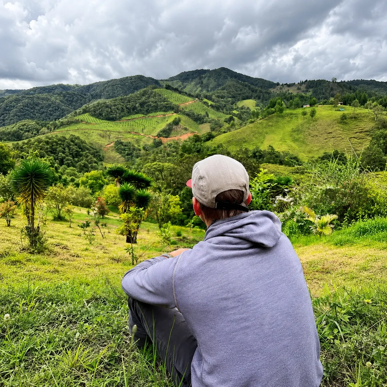 A man looking out over the mountains at Yaogará